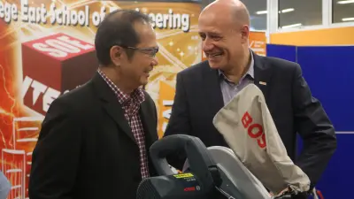Dr. Yek Tiew Ming, principal of ITE College East (left) and Martin Hayes, president of Bosch SEA (right) going through the benefits of the Bosch power tool